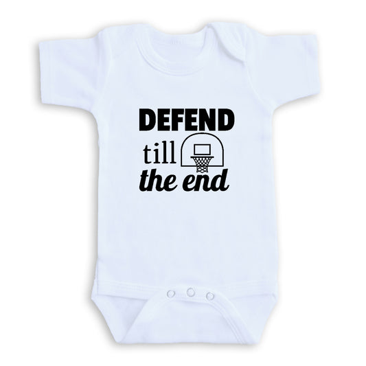 A white baby onesie with the text "DEFEND TILL THE END" printed on it.