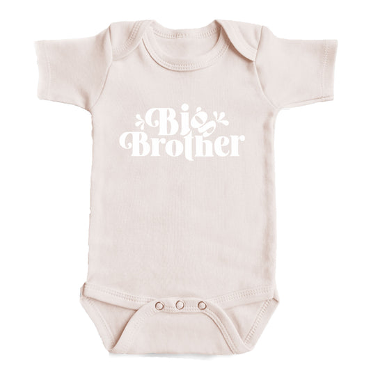 A baby onesie with the text "Big Brother" printed on it.