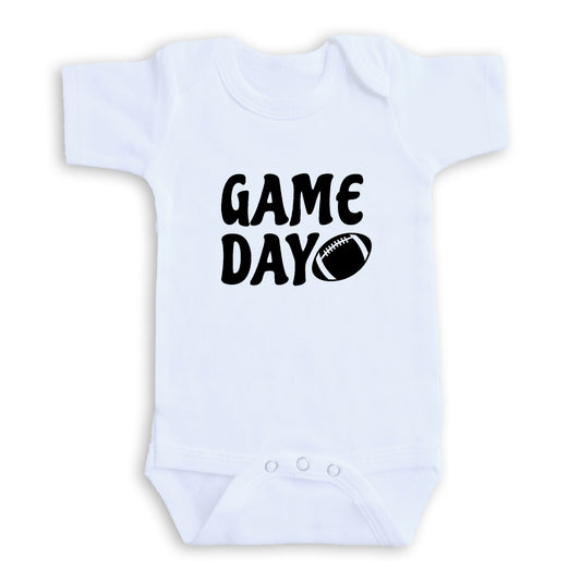 A white baby onesie with the text "GAME DAY" printed on it.