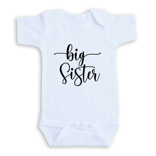 A white baby onesie with the text "big Sister" printed on it.
