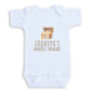 A white baby onesie with a graphic of a wooden chest containing gold coins and the text "GRANDPA'S GREATEST TREASURE" printed on it.