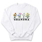 A white sweatshirt with a graphic design featuring a row of colorful flowers and the word "GRANDMA" printed on it.
