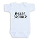 A white baby onesie with the text "middle brother" printed on it.