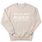 A beige sweatshirt with the text "WORLD'S BEST nana" printed on it.