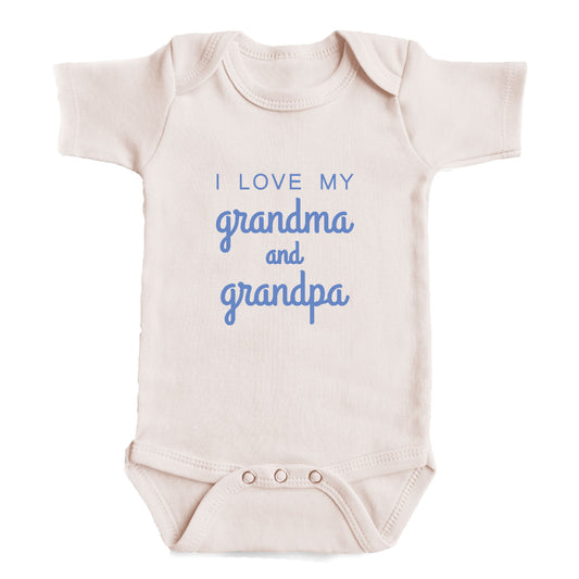 A baby onesie with the text "I LOVE MY GRANDMA AND GRANDPA" printed on it.