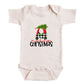 A white baby onesie with a Christmas-themed graphic and text printed on it.