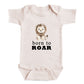 A baby onesie with a cartoon lion and the text "born to roar" printed on it.