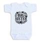A white baby onesie with the text "BIG SISTER" printed on it.
