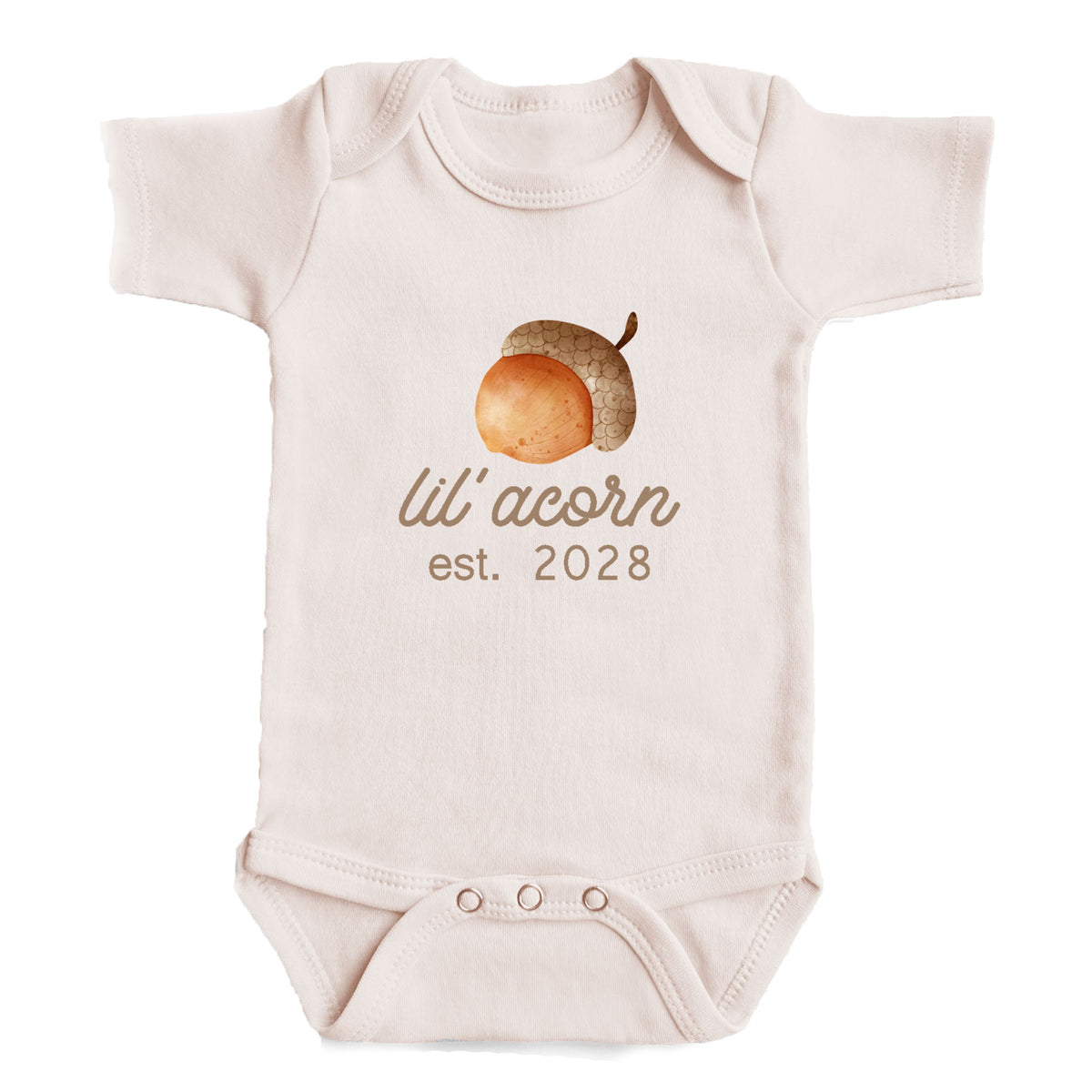 A baby onesie with an acorn graphic and the text " lil' acorn est. 2028" printed on it.