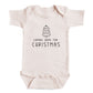 A baby onesie with the text "COMING HOME FOR CHRISTMAS" printed on it.