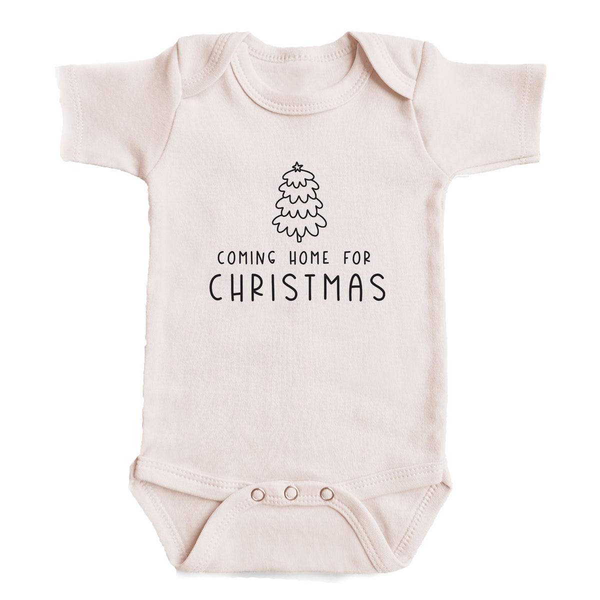 A baby onesie with the text "COMING HOME FOR CHRISTMAS" printed on it.