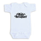 A white baby onesie with the text "Big Brother" printed on it.