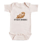 A baby onesie with an image of an otter and the text "OTTERLY ADORABLE" printed on it.