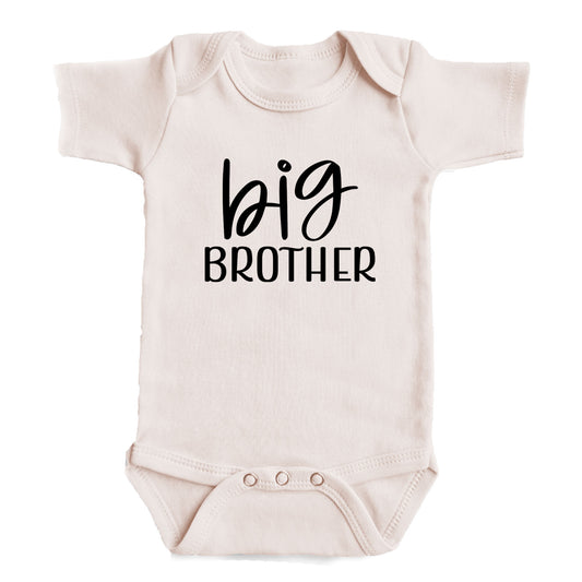 A baby onesie with the text "big brother" printed on it.