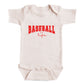 A white baby onesie with the text "BASEBALL life" printed on it in red letters.