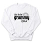 A white sweatshirt with the text "IN MY GRAMMY ERA" printed on it.