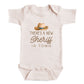 a baby onesie with a cowboy hat and the text "There's a new Sheriff in town" printed on it.