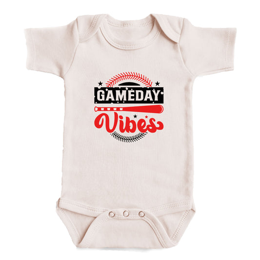 A white baby onesie with a graphic design on it.