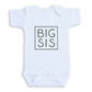 A white baby onesie with the text "BIG SIS" printed on it in a bold, black square font.