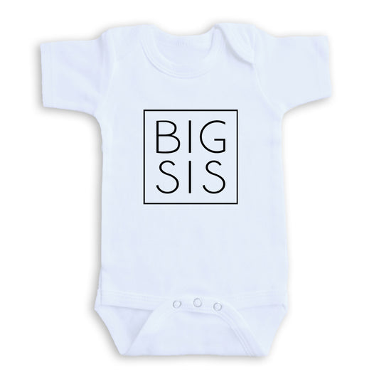 A white baby onesie with the text "BIG SIS" printed on it in a bold, black square font.