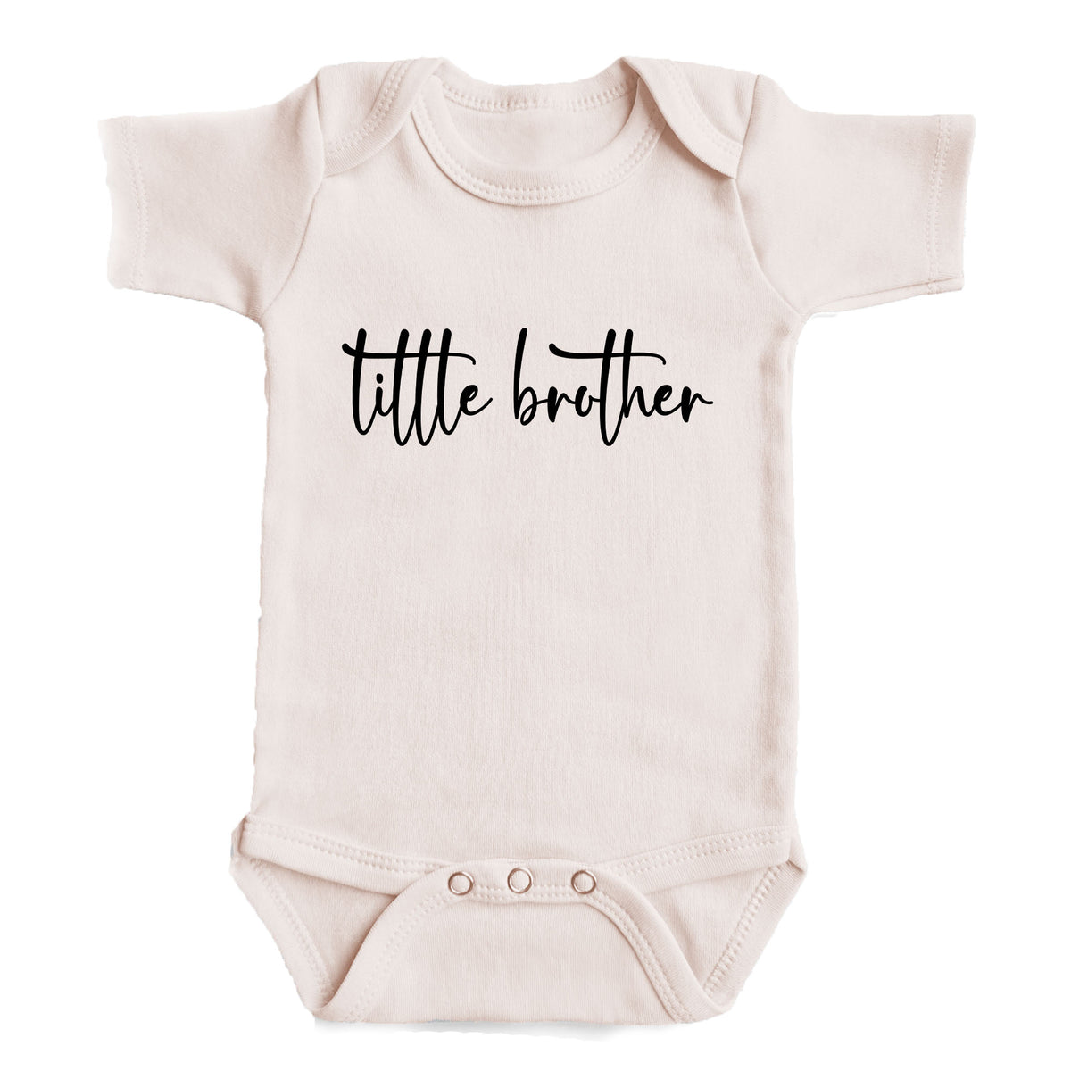 A baby onesie with the text "tittle brother" printed on it.