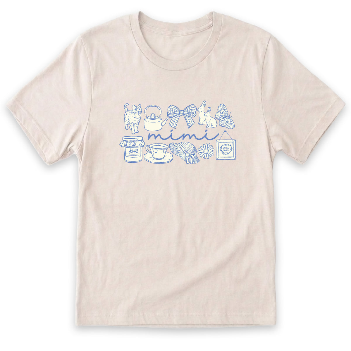 A light-colored t-shirt with a graphic design featuring various objects such as a teapot, cat, butterfly, and cup, along with the word "miiti" written across them.