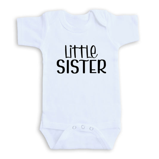 A white baby onesie with the text "Little Sister" printed on it.