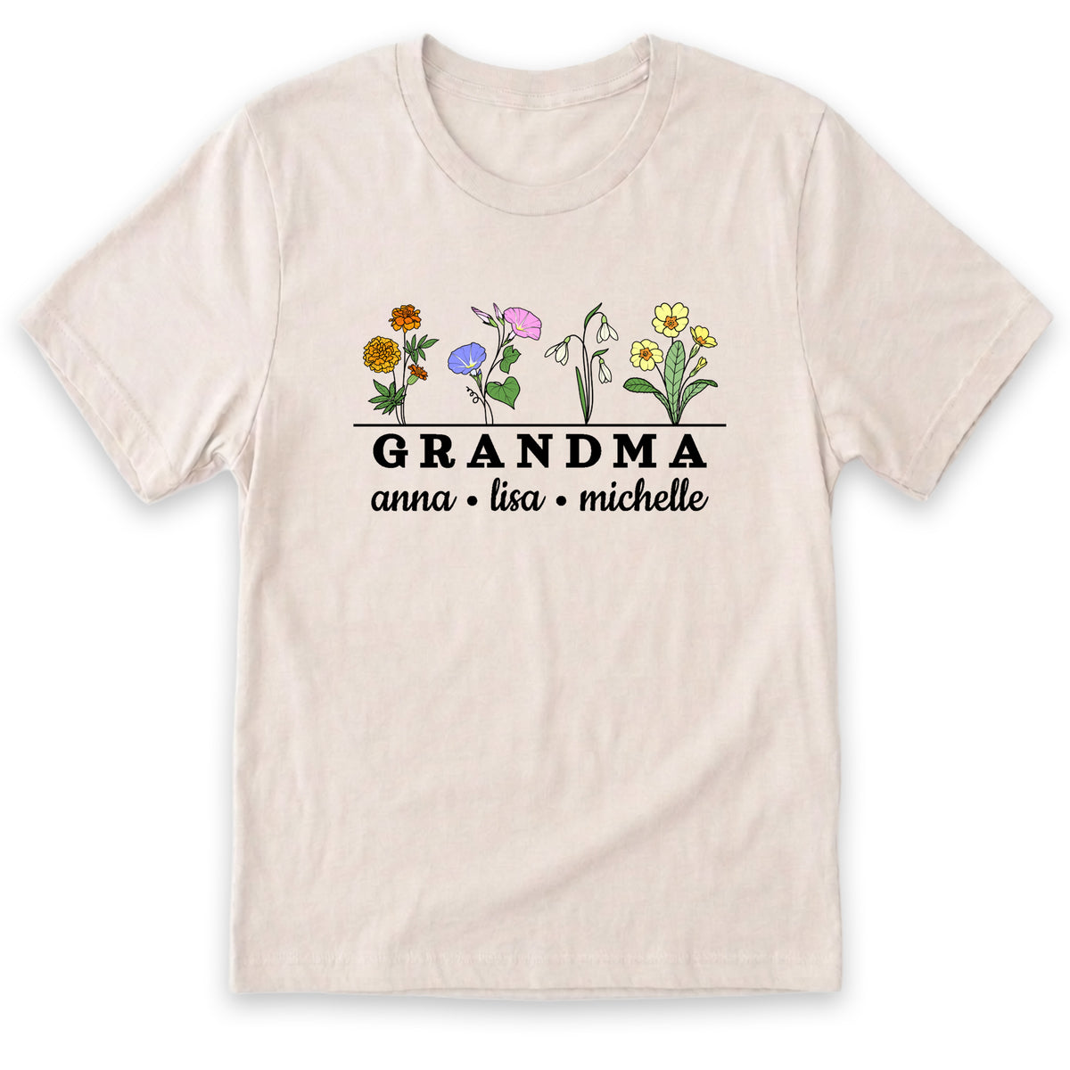 A light-colored t-shirt with a graphic design featuring a row of colorful flowers and the text "GRANDMA" below them.