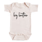 A baby onesie with the text "big brother" printed on it.