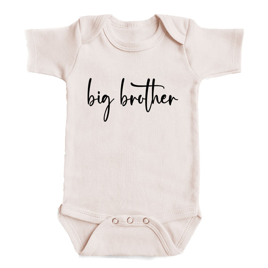A baby onesie with the text "big brother" printed on it.