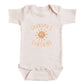 A baby onesie with the text "GRANDMA'S SUNSHINE" printed on it.