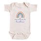 A baby onesie with a rainbow graphic and the text "auntie's bestie" printed on it.