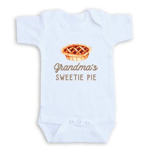 A white baby onesie with a printed design of a pie and the text "Grandma's SWEETIE PIE" printed on it.