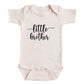 A baby onesie with the text "little brother" printed on it.