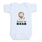 A white baby onesie with a cartoon lion and the text "born to Roar" printed on it.