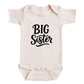 A baby onesie with the text "BIG Sister" printed on it.