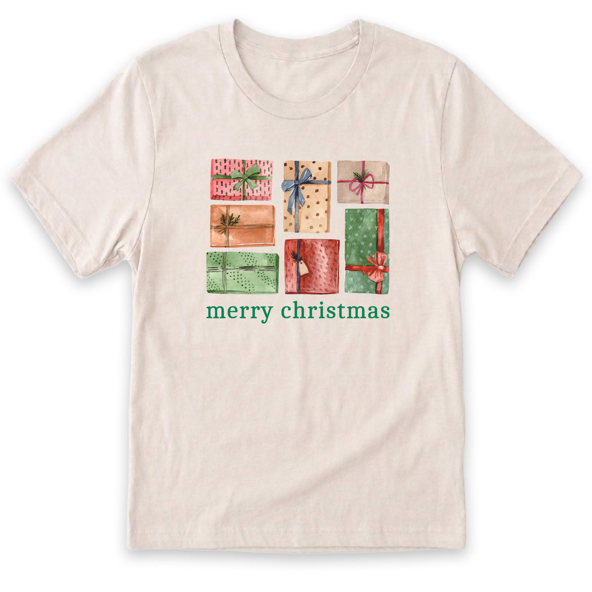 A white t-shirt with a graphic design featuring a collage of colorful gift boxes with bows, accompanied by the text "merry christmas" in green.