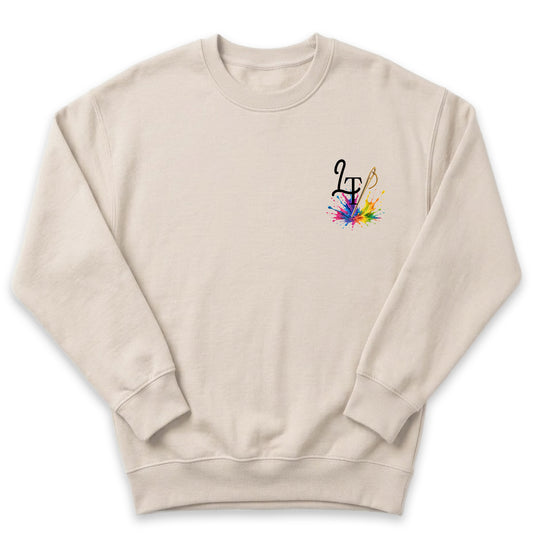A beige sweatshirt with a colorful graphic design on the left side.