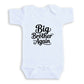A white baby onesie with the text "Big Brother Again" printed on it.