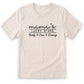 A beige t-shirt with the text "mini's LUCKY STARS" printed on it in a casual, handwritten style.