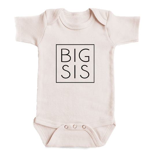 A baby onesie with the text "BIG SIS" printed on it.