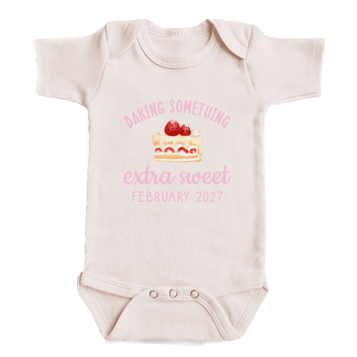 A baby onesie with a pink design and text on it.