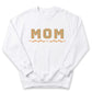 A white sweatshirt with the word "MOM" printed on it in a checkered pattern.