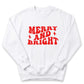 A white sweatshirt with the text "MERRY AND BRIGHT" printed in red.