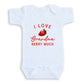 A white baby onesie with a red strawberry graphic and text that says "I LOVE Grandma Berry Much".