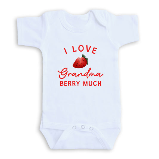 A white baby onesie with a red strawberry graphic and text that says "I LOVE Grandma Berry Much".