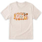A white t-shirt with a floral design and the word "GIGI" printed on it.