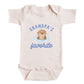 A baby onesie with a cute cartoon image of an otter and the text "GRANDPA'S FAVORITE" printed on it.