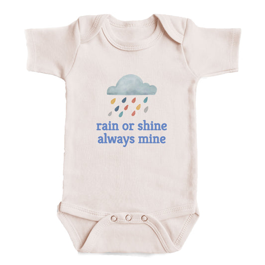 A baby onesie with a rain cloud and raindrops graphic, along with the text "rain or shine always mine" printed on it.