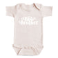 A baby onesie with the text "Big Brother" printed on it.